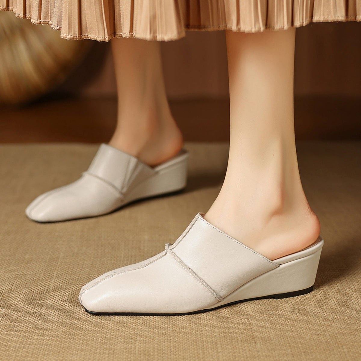 Halia | Mules in vera pelle con zeppa
