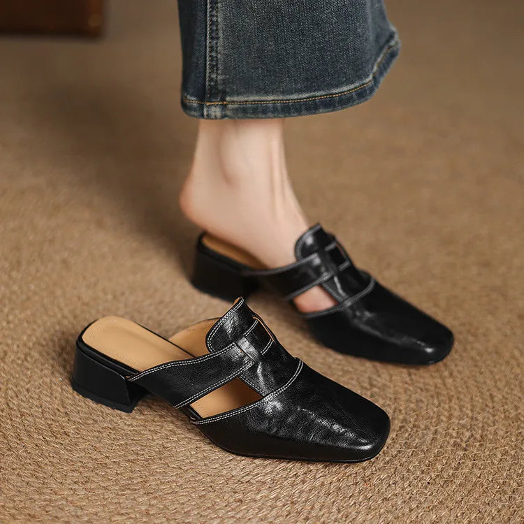 Ingrid | Mules in vera pelle con tagli laterali