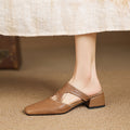 Darea | Mules in vera pelle con tagli laterali