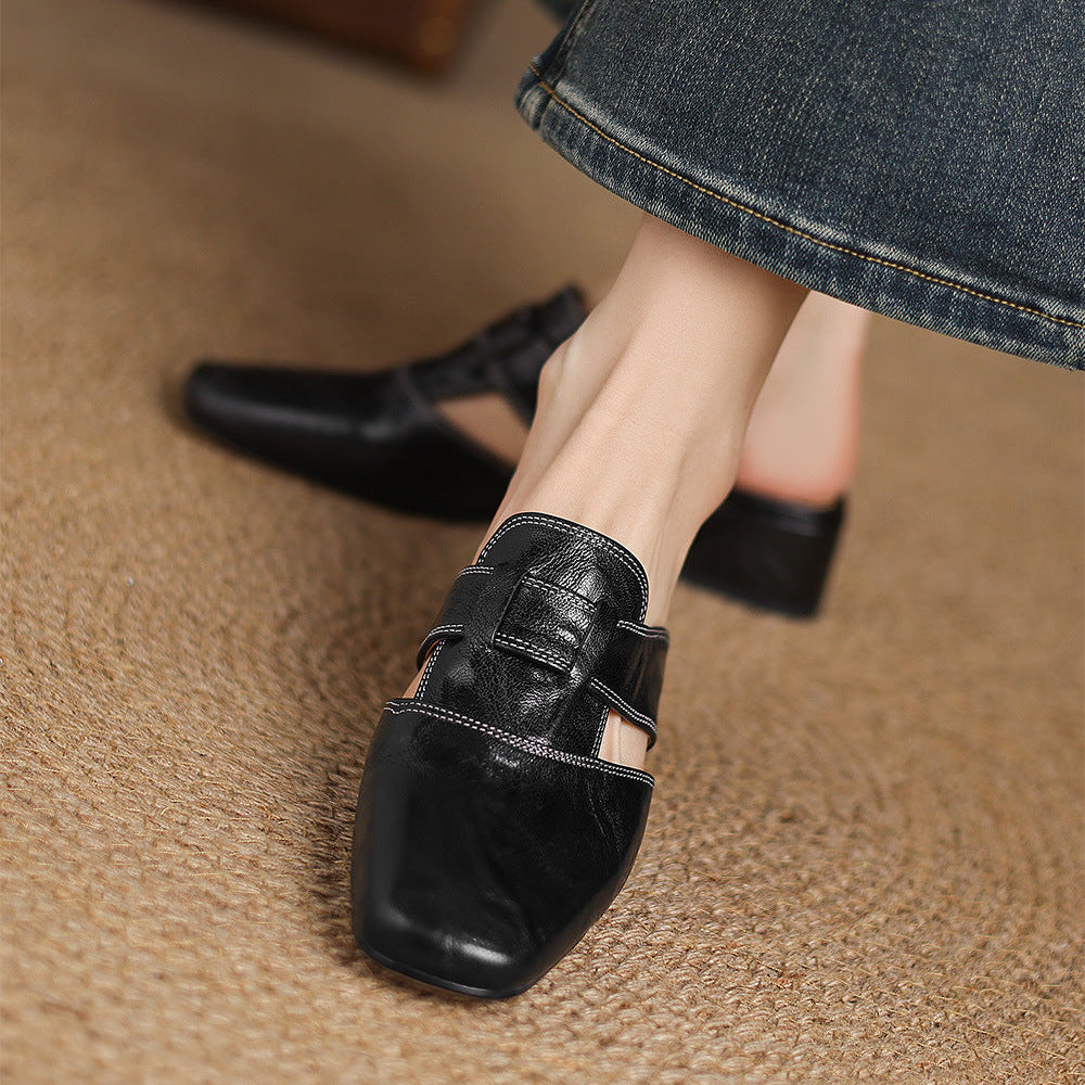 Brea | Mules in vera pelle con tagli asimmetrici