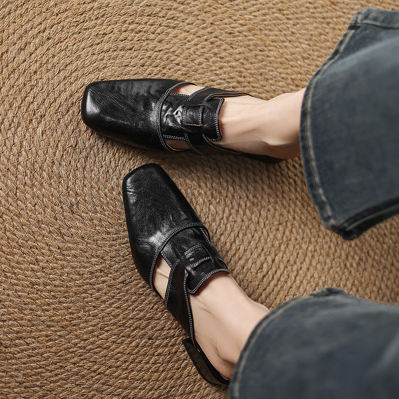 Brea | Mules in vera pelle con tagli asimmetrici