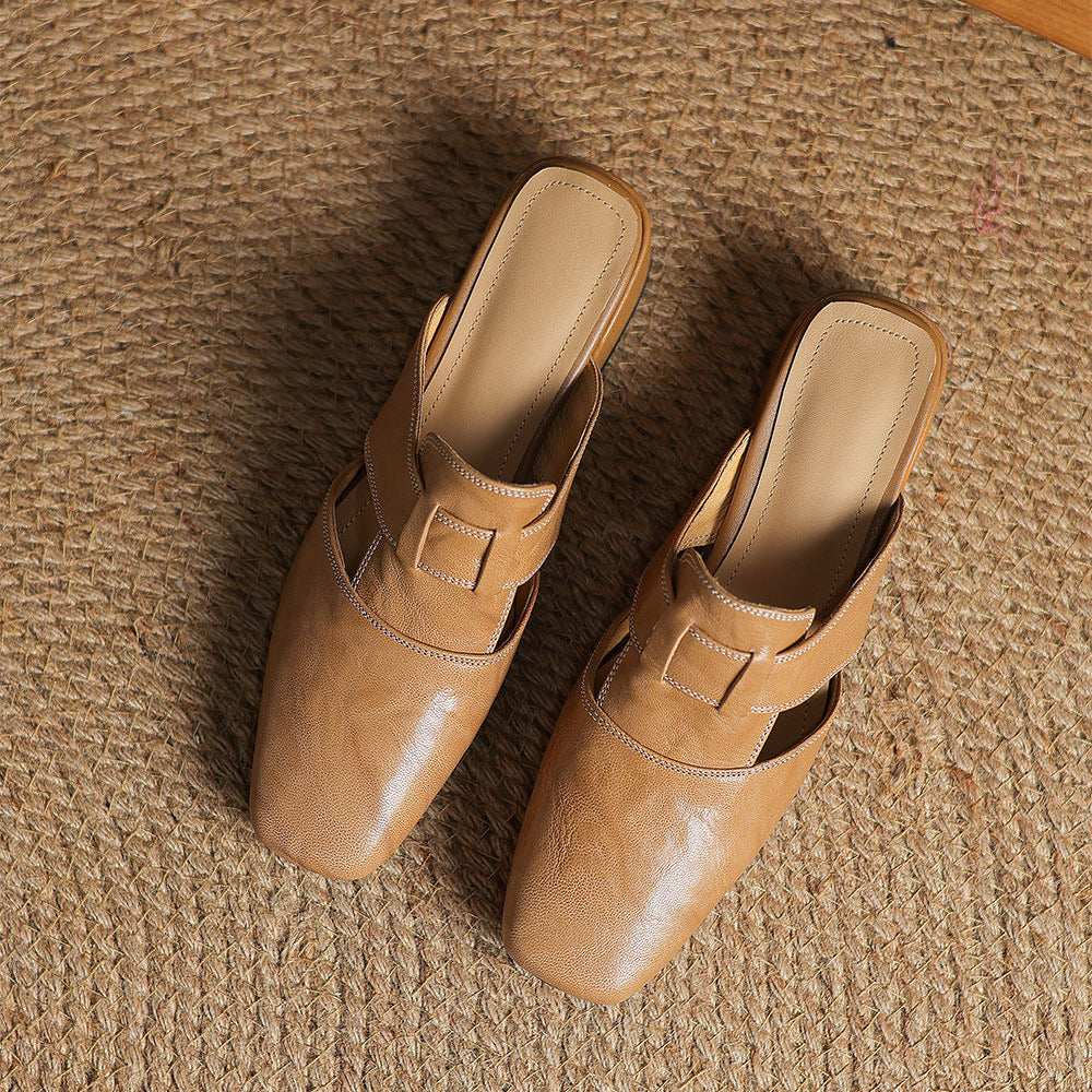 Brea | Mules in vera pelle con tagli asimmetrici